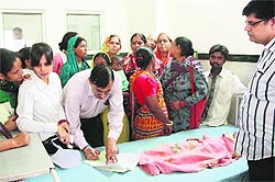 Three hours gone, the 6-year-old girl gangrape victim awaits her medical examination in a Gurgaon hospital
