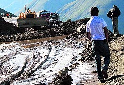 Muck being cleared on the Rohtang road in Manali, where tourist traffic jams are legendary