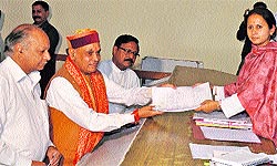 Chief Minister PK Dhumal submits his nomination papers in Hamirpur on Tuesday