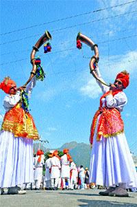 Folk dancers perform during the inaugural day of the Navaratra festival in Katra