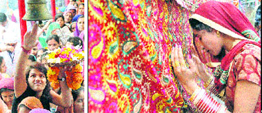 Devotees pay obeisance at Goddess Kali Devi Temple in Jammu on Tuesday.