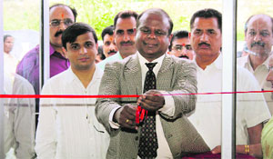 Chief Postmaster General John Samuel inaugurates a post office at Dumana in Jammu on Tuesday.