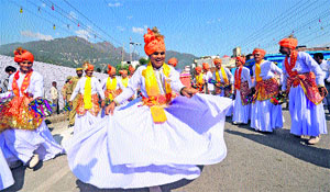 Folk dancers perform on the inaugural day of the Navratra celebrations in Katra on Tuesday.