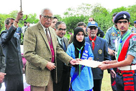 Governor NN Vohra gives away certificates during the Rajya Puraskar Award Ceremony at Raj Bhawan in Srinagar on Tuesday.