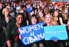Supporters of US President Barack Obama display placards during a campaign rally at the Ohio Wesleyan University in Delaware