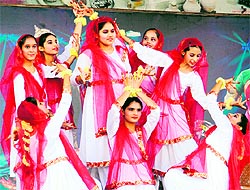 Students of Sri Guru Harkrishan Public School perform dance items during the inauguration of the CBSE Cluster XVI Volleyball Tournament in Amritsar on Wednesday