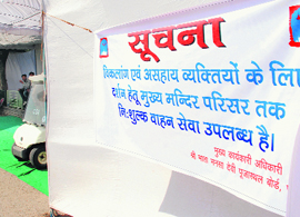 A banner regarding the availability of a free golf cart service for the physically challenged on display at the Mansa Devi temple in Panchkula on Wednesday.