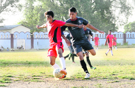 Players in action during a match in the Lala Nemi Dass Memorial Football Tournament in Dehradun on Wednesday.