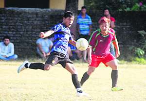 A match in progress during the Kargil Martyr Jaideep Bhandari Memorial Football Tournament in Dehradun on Wednesday.