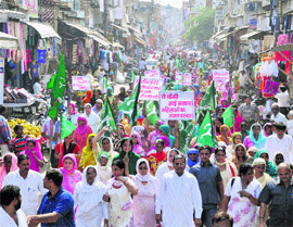 INLD activists hold a demonstration at Bahadurgarh town in Jhajjar on Wednesday against the rising crime graph in the state. 