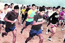 Aspirants appear in the physical fitness test at an Army recruitment rally at Guru Nanak Stadium in Kapurthala