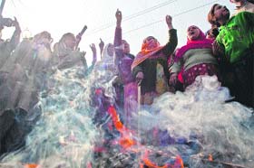 Protesting women burn an effigy of Chief Minister Omar Abdullah in Srinagar on Wednesday