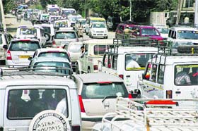 Vehicles stuck in a traffic jam at Pantha Chowk in Srinagar