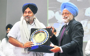 BS Dhillon, Vice Chancellor, PAU, honouring Deputy Chief Minister Sukhbir Singh Badal in Ludhiana.