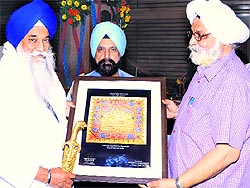 AS Brar, Vice-Chancellor of Guru Nanak Dev University, being honoured by Gurbachan Singh, Jathedar, Sri Akal Takht Sahib, in Amritsar on Thursday