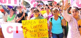 Members of women organisations from Punjab hold a protest for their rights in Chandigarh on Thursday