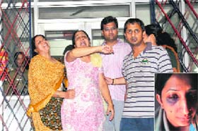 The victim, Monica Goyals family members hold a protest outside the Sector 19 police station in Chandigarh on Thursday. Tribune photo: Pradeep Tewari (Inset) A file photo of the victim shows injury marks on the eye allegedly caused by her in-laws in December 11
