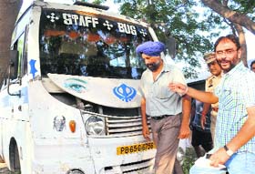 Head Constable Najjar Singh (in turban), who was arrested for allegedly smuggling garments in a bus (seen in the background)