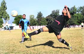A match in progress during the Lala Nemi Dass Memorial Football League being played in Dehradun on Thursday