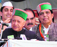 State Congress chief Virbhadra Singh addresses a rally at Solan on Thursday.