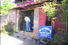 Students being taught at a shop in Baramulla. 