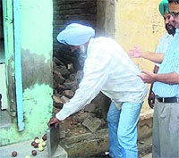 Officials of the health department destroy adulterated sweets at a shop in Jagraon on Thursday