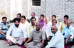 Residents stage a dharna outside the residence of the MC Commissioner in Ludhiana on Thursday