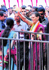 Congress president Sonia Gandhi waves to the crowd during a public rally in Mangalore on Thursday. 