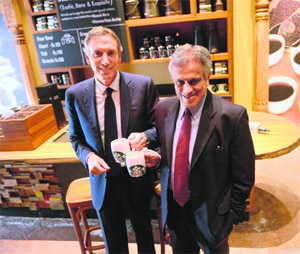 Starbucks Coffee Co chairman Howard Schultz (L) with Tata Global Beverages vice chairman R.K. Krishnakumar at a news conference at Indias first newly-inaugurated Starbucks outlet in Mumbai on Friday.