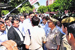 Lawyers and police officials argue at the district courts in Panchkula on Friday