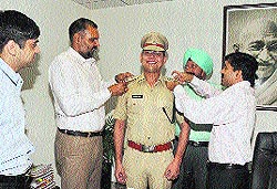 Naunihal Singh, SSP, and other officials at the rank ceremony after the promotion of IPS Deshraj Singh in July