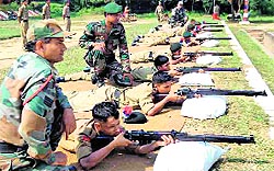 Cadets aim at targets under the guidance of Army personnel at the NCC training camp in Roorkee on Friday