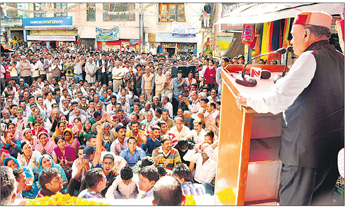 PK Dhumal addresses a public rally at Dharampur in Solan district on Friday.