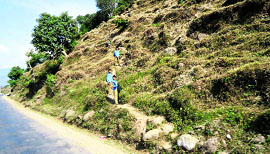 Children on their way to school through a difficult mountain terrain in Rajouri.