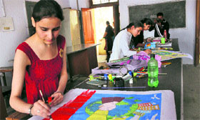 Students during an inter-college poster making competition at Government College for Women, Parade, in Jammu on Friday.