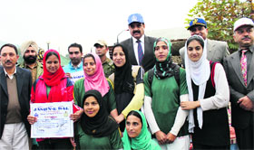 Director General of Police (DGP) Ashok Prasad and Additional Director General of Police (ADGP) K Rajendra Kumar with the winners at the Jashn-e-Dal event in Srinagar on Friday.