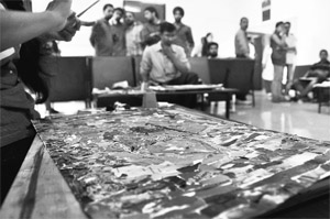 Students take part in a collage-making competition during the Golden Jubilee Inter-College Youth Festival at Punjab Agricultural University in Ludhiana on Friday. 