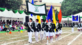 Students perform a march-past on the annual sports meet of St Thomas College in Dehradun on Saturday.