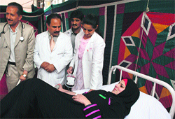 A girl donates blood during a blood donation camp at LD Hospital on Saturday. 