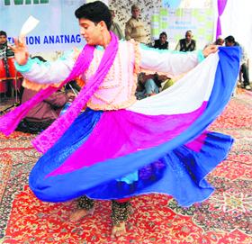 A Kashmiri folk dancer performs at a function organised by the Jammu and Kashmir Tourism Department in Srinagar on Saturday.