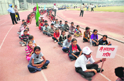 Players in casuals wait for the Sports Minister at Guru Nanak Stadium on Saturday. 