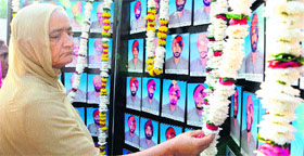 Kin of policemen who were killed during the days of terrorism pay their tributes to them on Police Commemoration Day in Amritsar on Sunday