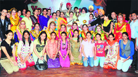 Members of the team of the Khalsa College of Education, Ranjit Avenue, who won the overall championship trophy in the Zonal Youth Festival at Guru Nanak Dev University in Amritsar on Sunday