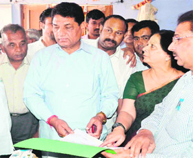 Uttarakhand Health Minister Surendra Singh Negi along with CMO Deepa Sharma at a health camp in a rural area of Haridwar on Sunday. 