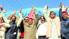 CM PK Dhumal with candidate Jawahar Lal Thakur at Panarsa in Darang on Sunday.
