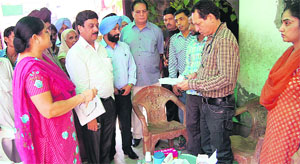 A health team visits Sangat Singh Nagar in Jalandhar on Sunday. 