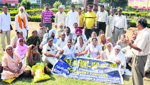 PoK refugees hold a protest at Panama Chowk in Jammu on Sunday.