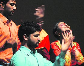Artistes enact a play Ghumayeeat Police Auditorium in Jammu on Sunday.