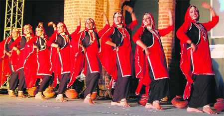 Students of the Government College of Education, Badal village, perform during the Sufi International Festival at Khalsa College in Amritsar.