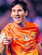 Lionel Messi celebrates yet another goal during Barcelonas 5-4 win over Deportivo in Coruna, Spain, on Saturday night